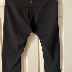 Lululemon black knee-length leggings. Size L